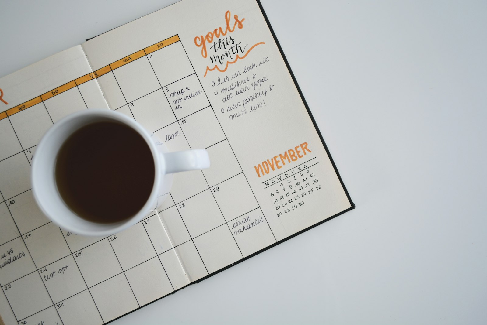 Planner and coffee laid out for deadline planning