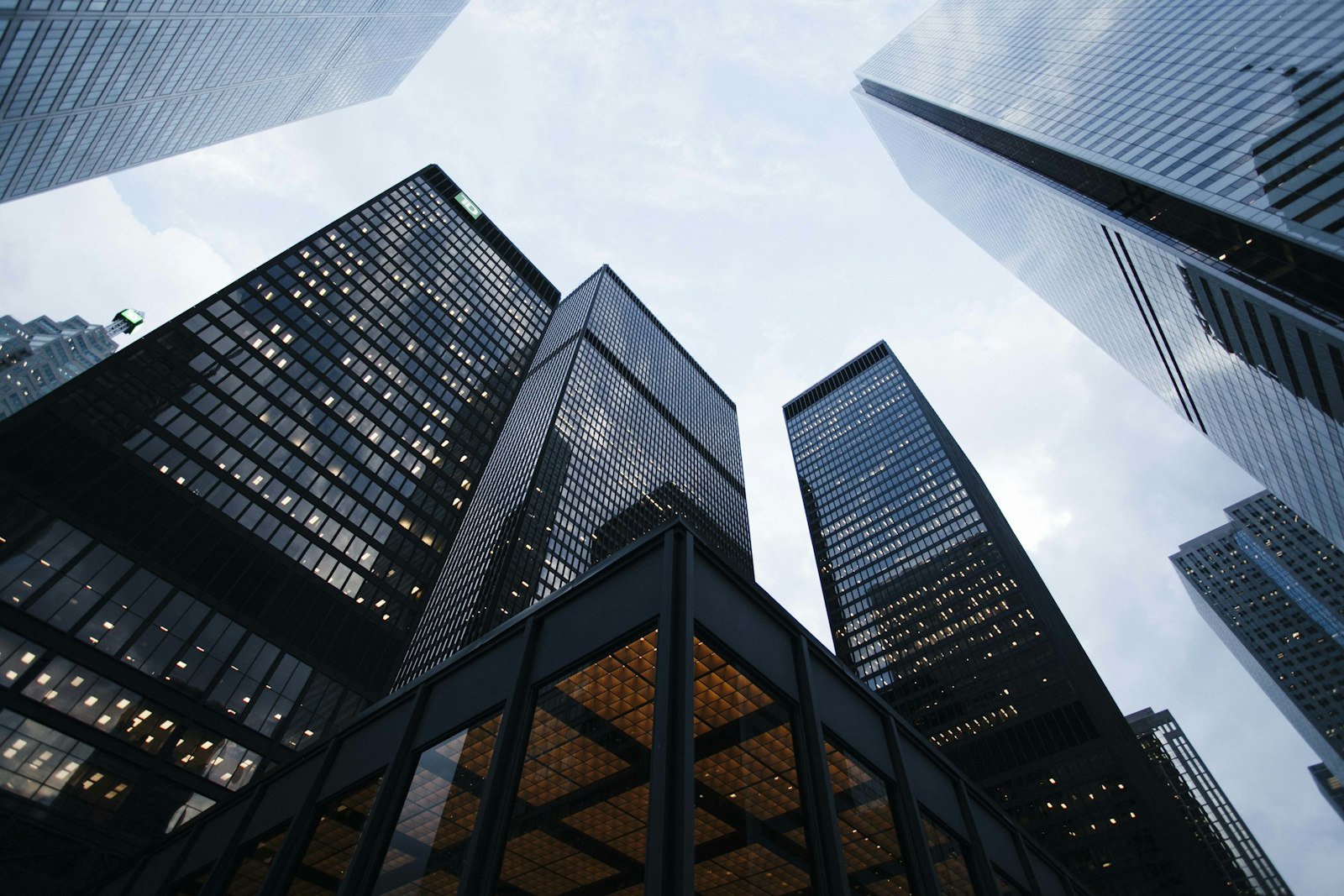 Looking up at tall buildings against the sky