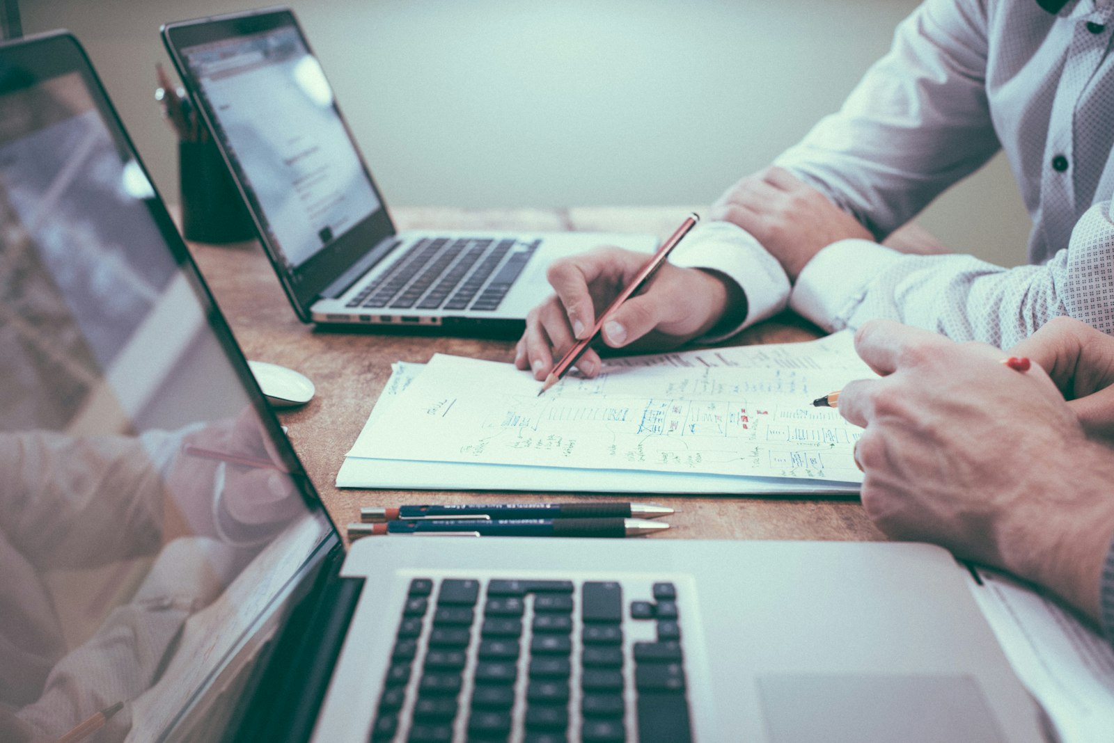 An advisor reviewing personal financial documents with a client